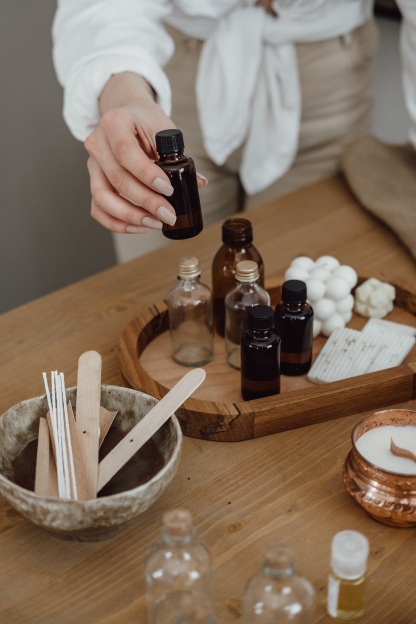 Woman Selecting Scented Oil for Homemade Candle